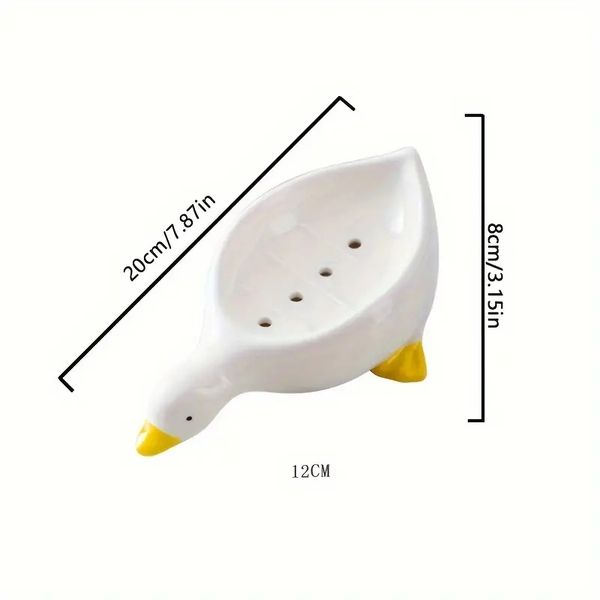 1 Pack ceramic duck-shaped soap dish with drainage, serving as a soap tray and sponge holder for bathroom or toilet use
