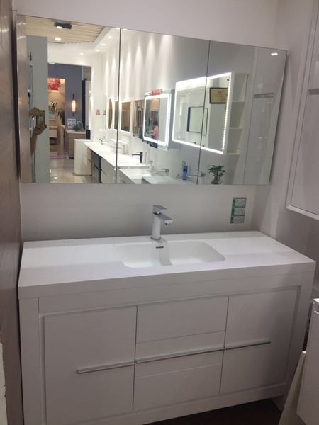 1300mm bathroom vanity with soft-close doors, solid surface stone basin, and floor-mounted mirror cabinet