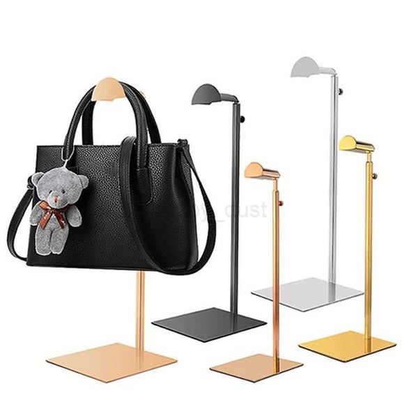 Adjustable hanging display stand for polished gold or silver handbags, purses, and organizers