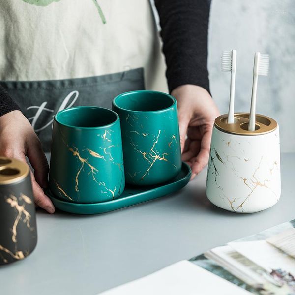 Bathroom accessory set featuring a marble-pattern ceramic toothbrush holder, mouthwash cup, and couple wash brushing base in a 3-piece collection