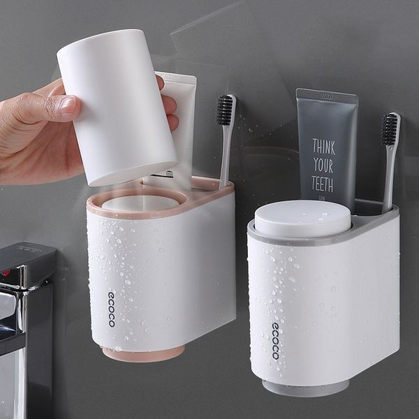 Bathroom accessory set including wall-mounted toothbrush holder, toothpaste dispenser, and storage rack
