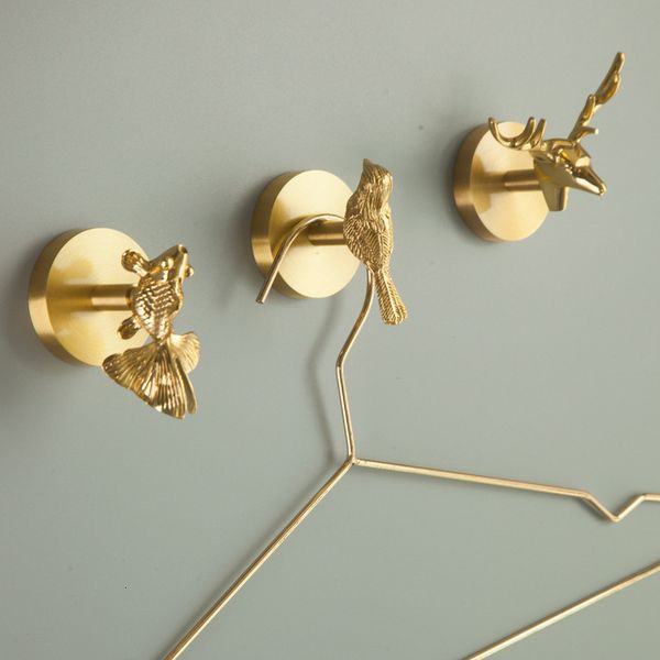 Brass bathroom shelf with animal-themed key hooks for wall-mounted coat and hat storage