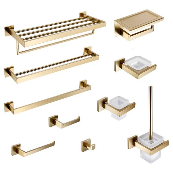 Brushed gold bathroom accessories including toilet brush, paper towel holder, shelf, hooks, soap dispenser, and cup holder