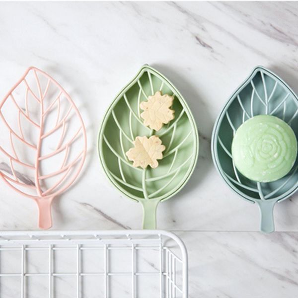 Double-walled plastic soap tray in leaf shape for bathroom storage