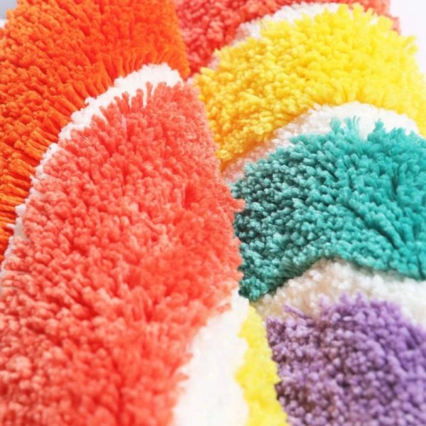 Inyahome's half-circle rainbow bath mat is non-slip, super soft, and highly absorbent, ideal for bathrooms or living spaces