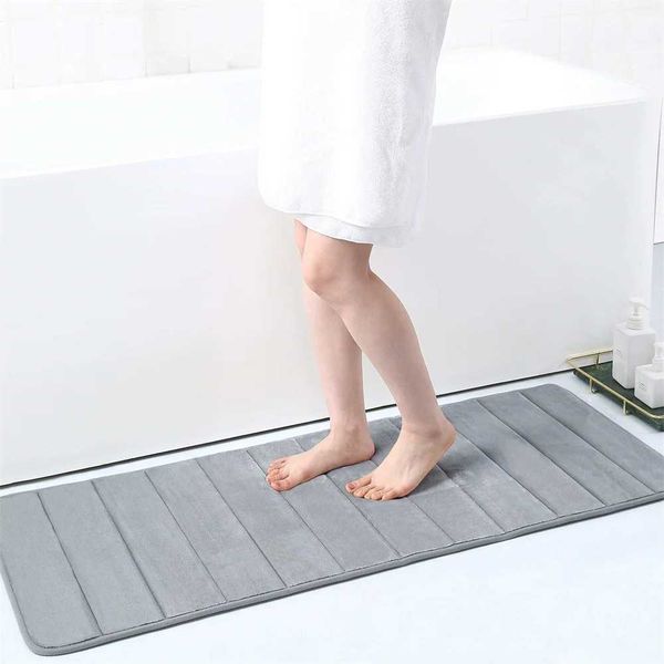 Kitinjoy's plush memory foam bath mat absorbs water quickly, providing a soft, non-slip surface for shower or bathroom floors