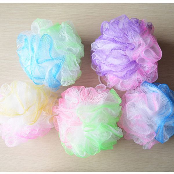 Large floral shower bath with flower-shaped bath balls, bubble bath brush, and colorful flower-infused scrub balls for mud and body rubs