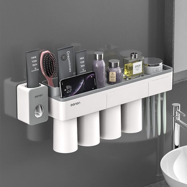 Magnetic toothbrush holder with inverted cup for bathroom storage, includes toothpaste squeezer and multifunctional accessories