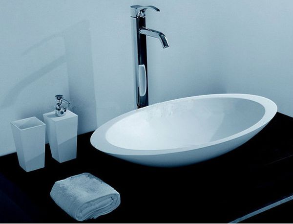 Oval solid surface stone-washed sink designed for above-counter vanity or laundry use, model RS3857