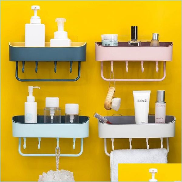 Plastic wall-mounted bathroom shelf with 4 hangers for soap and shampoo storage, self-adhesive for easy installation
