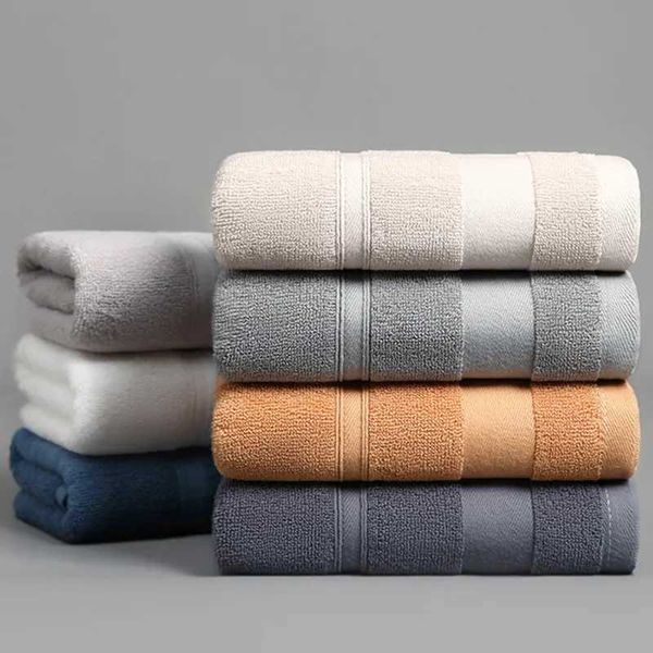 Thickened cotton bath towel enhances water absorption, offering a soft and cozy solid-colored option for adults