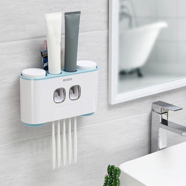 Wall-mounted automatic toothpaste dispenser with toothbrush holder and cup storage for bathroom organization