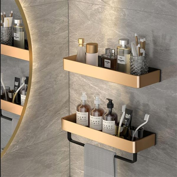 Wall-mounted bathroom corner shelf in gold and black aluminum for storage