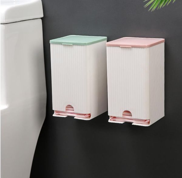 Wall-mounted bathroom napkin holder with multifunctional storage for paper towels, sanitary napkins, and cotton swabs