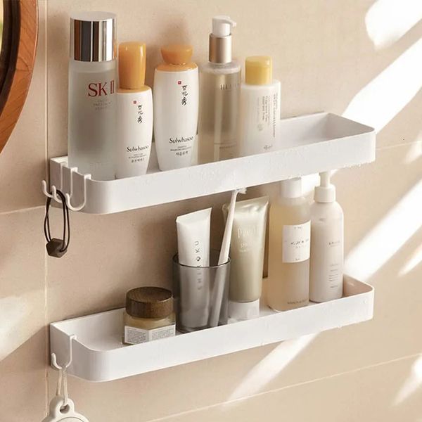 White self-adhesive bathroom shelves for organizing toiletries like body wash and shampoo